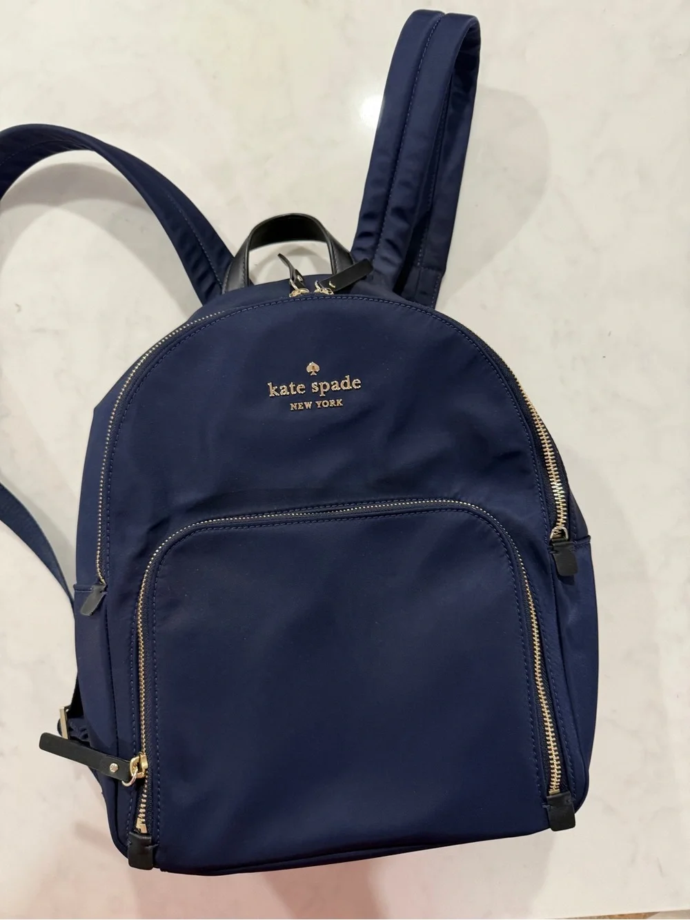 kate spade navy blue nylon backpack with gold hardware